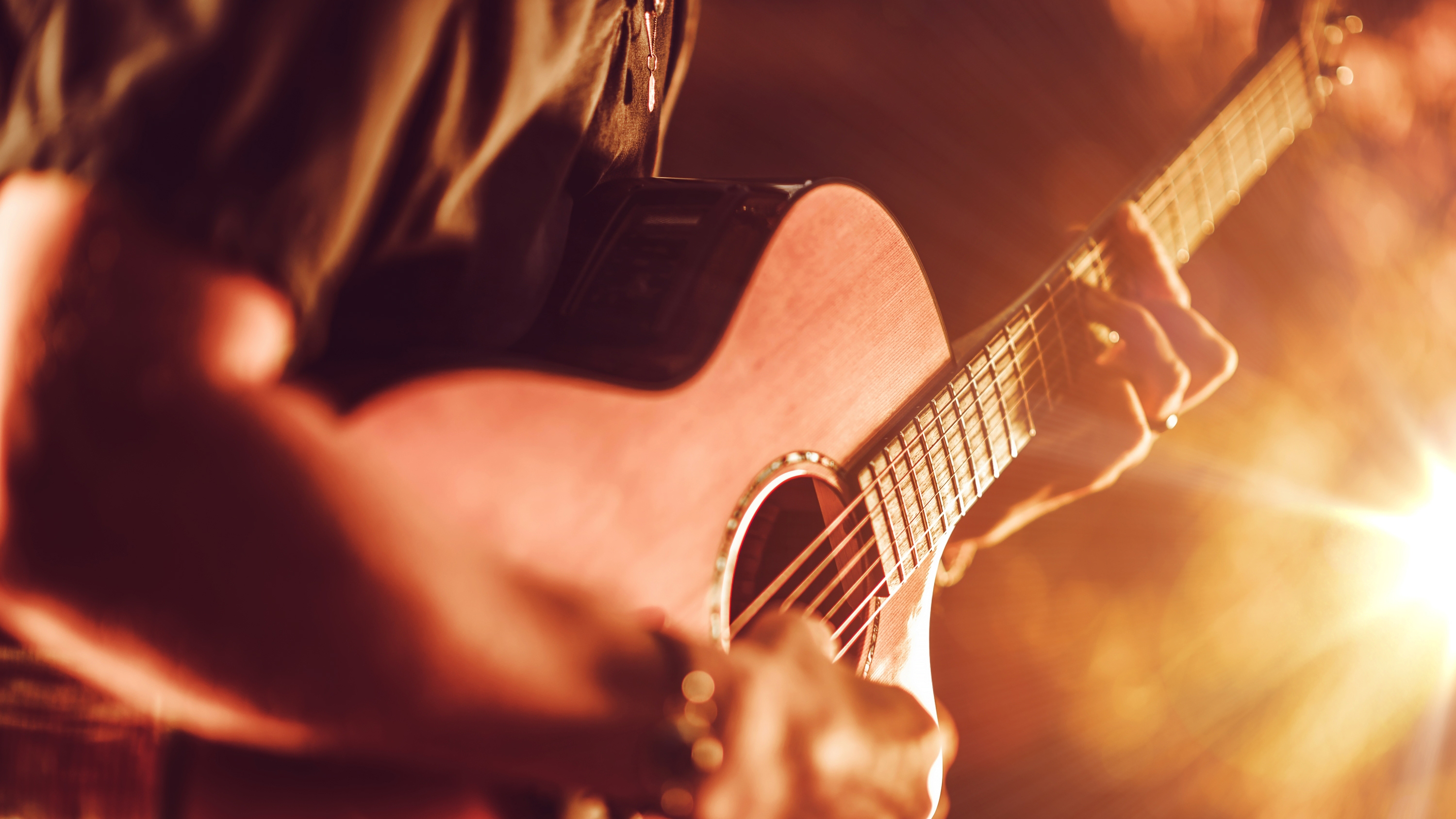person playing live guitar